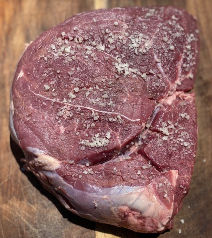 L2 Ranch grass-fed top sirloin steak on cutting board