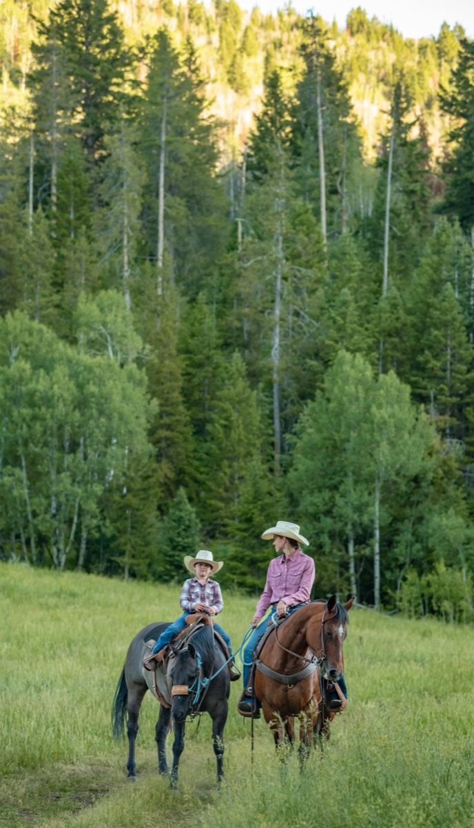 L2 Ranch family on horseback in Utah mountain pasture